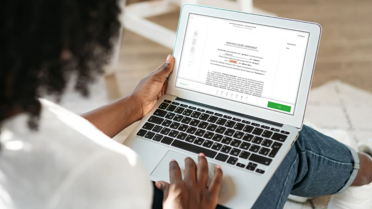 Close up on a plate of mashed potatoes, topped with baked pork chops with cream of mushroom soup, and a side of green beans.