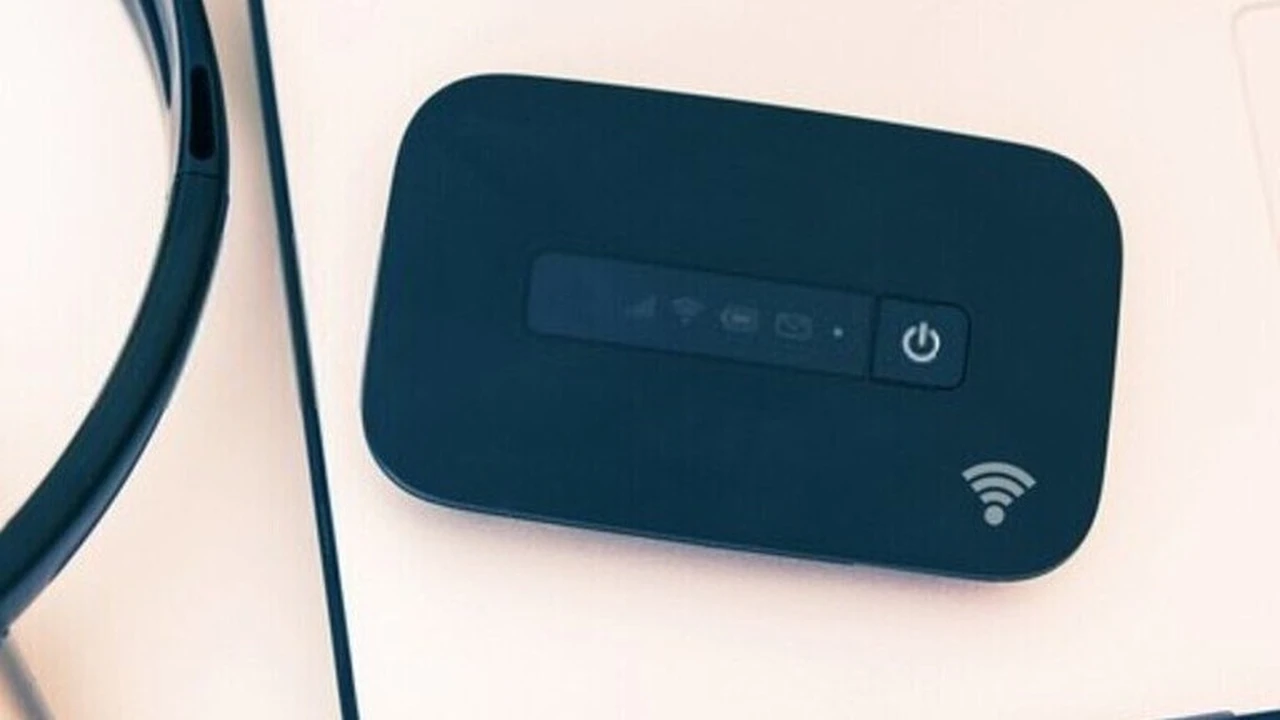 Two mint chocolate milkshakes with whipped cream and green sprinkles.